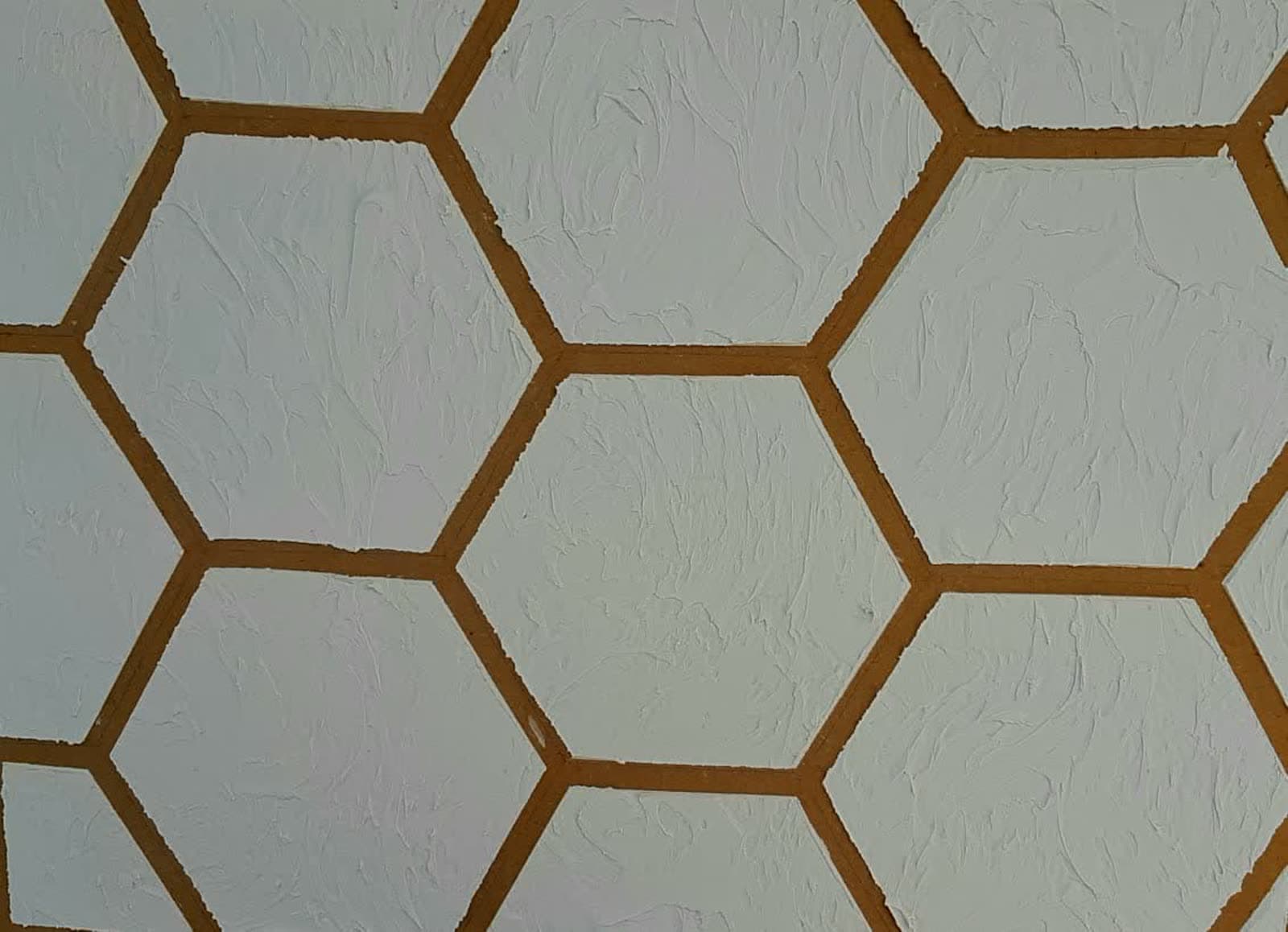 White honeycomb-pattern textured wall finish